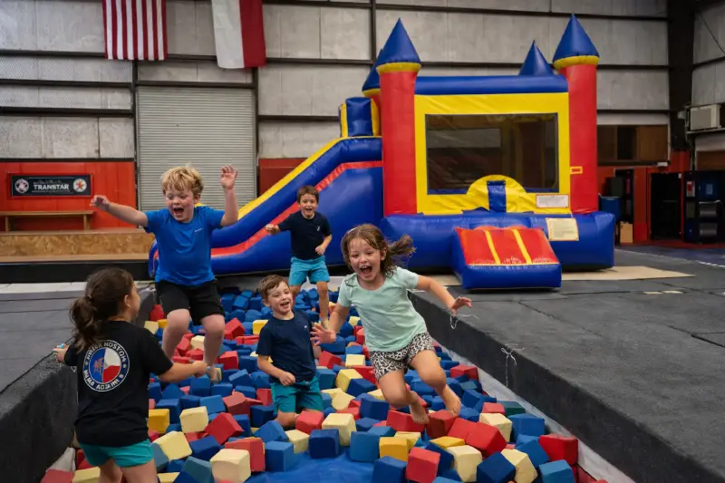 Kids jumping in the foam pit at a Bouncing Fun Factory birthday party in Waco TX